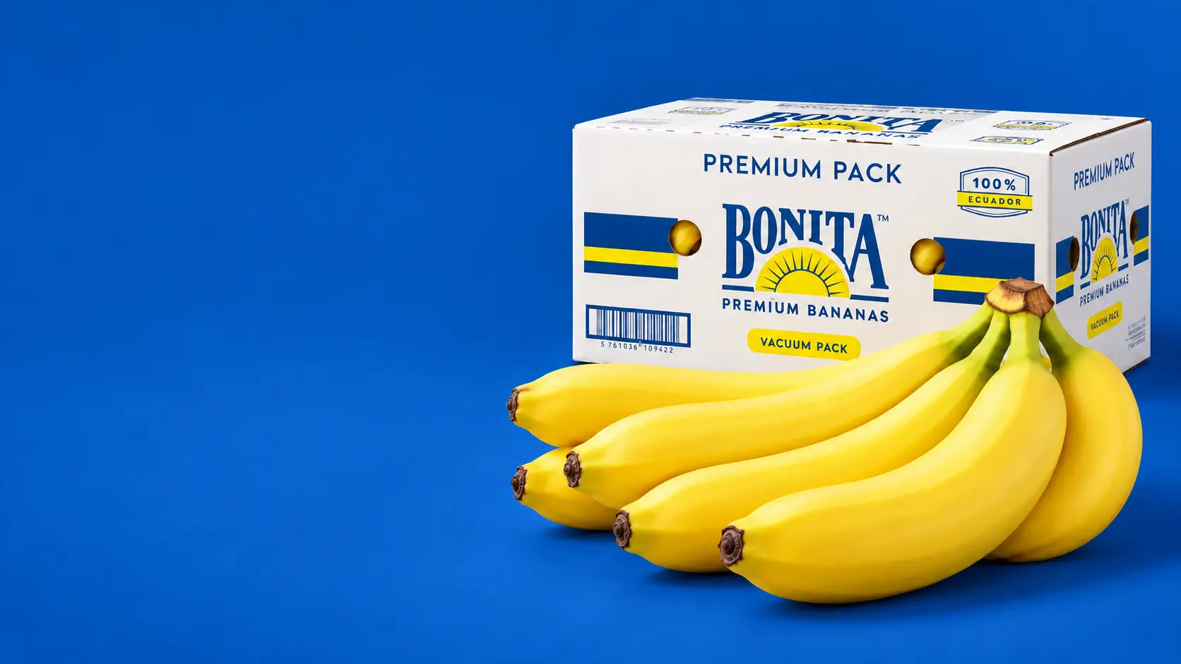 Bonita Premium Pack box next to a bunch of bananas on a blue background.